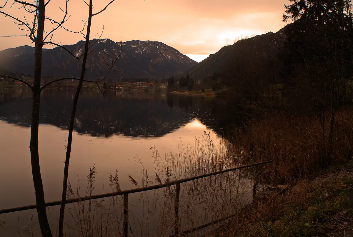 Evening at the Schliersee, mountains reflected in the calm water